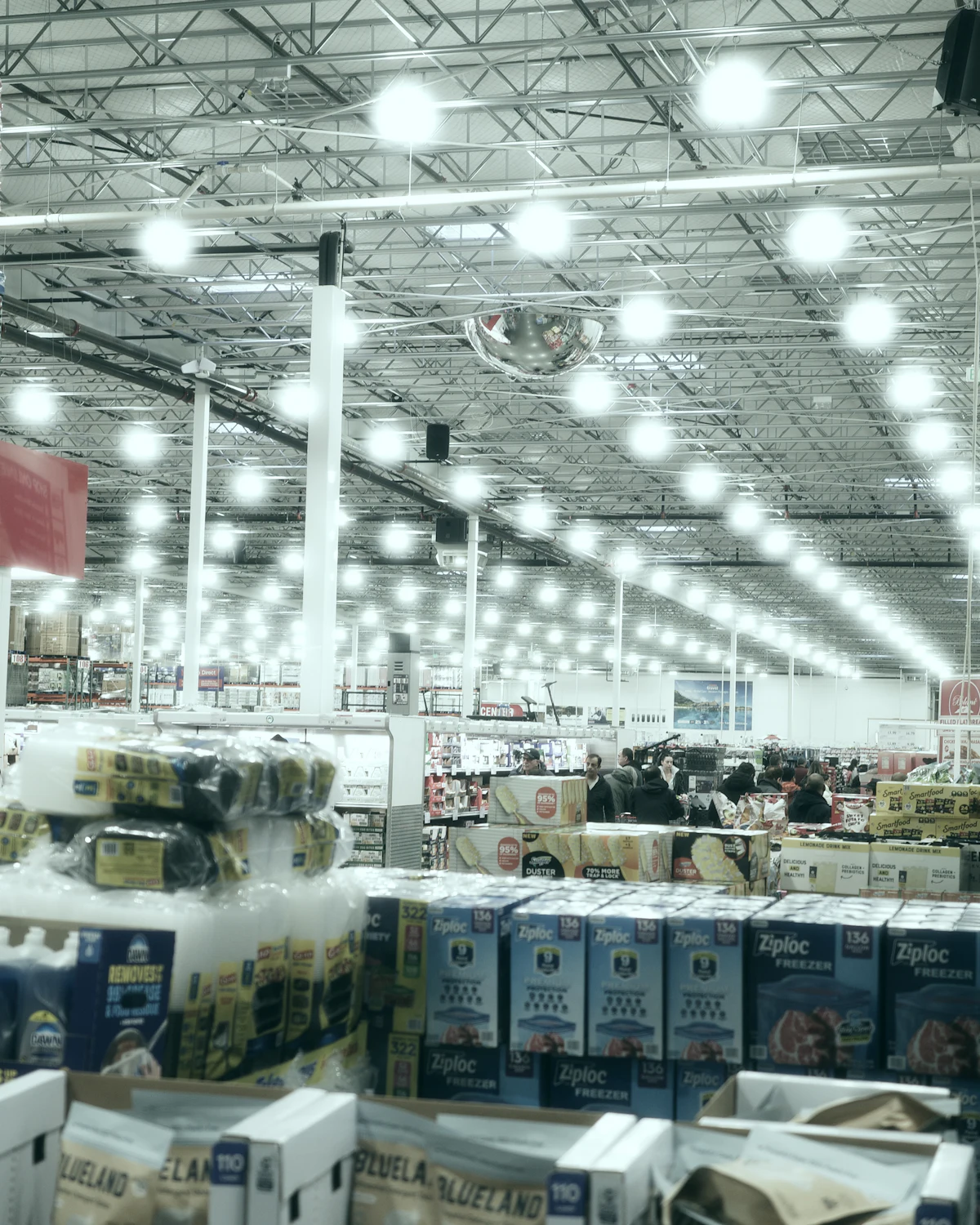 Wide aisle in a brightly lit warehouse store